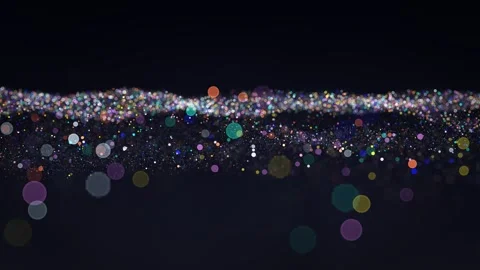 Vibrant multicolored particles slowly floating in a dark void, creating a Stock Footage 341653755