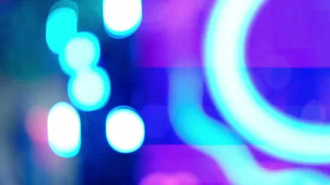 Vibrant neon lights glow on a dynamic out of focus  background Stock Footage 322810800