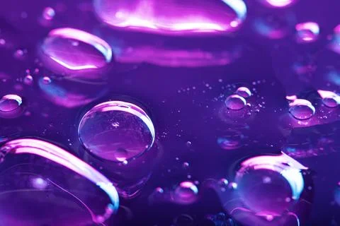 Vibrant neon purple liquid background Stock Photos