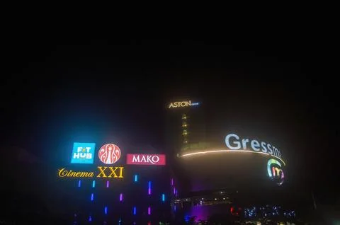 A vibrant night scene of Gressmall in Gresik, Indonesia, featuring illumina.. Stock Photos