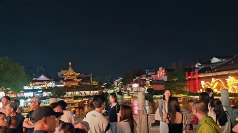 A vibrant night scene in Nanjing, capturing a bustling festival atmosphere with Stock Footage 338283306