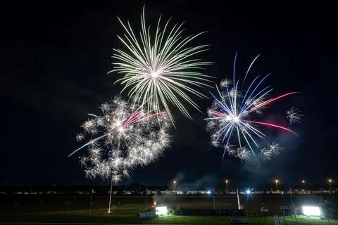 Vibrant night sky illuminated by an array of colorful fireworks bursting above a Stock Photos