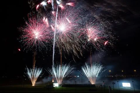 Vibrant night sky illuminated by an array of colorful fireworks bursting above a Stock Photos