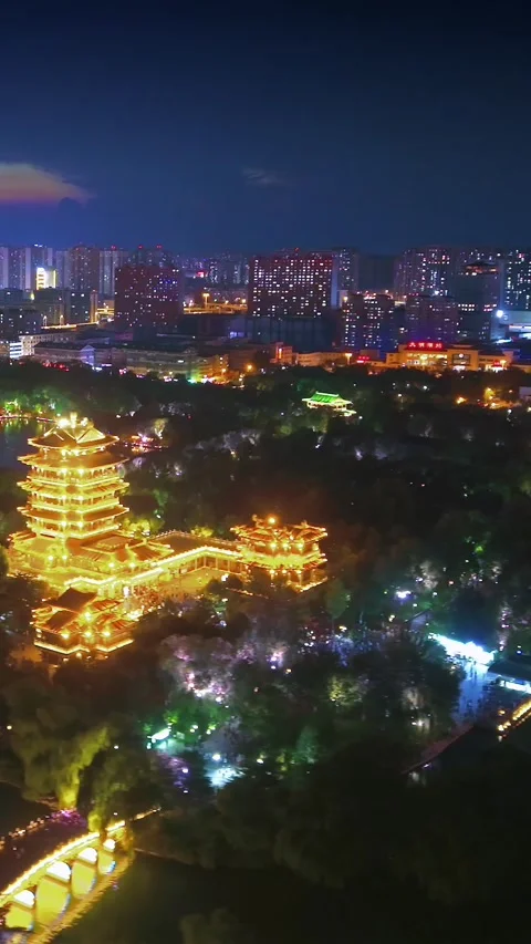 Vibrant Night View of Jinan's Daming Lake and Illuminated Chaoran Tower Stock Footage 331121384