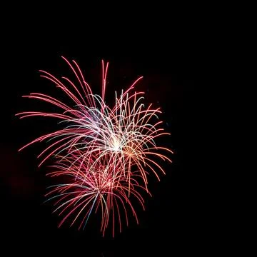 Vibrant nighttime display of fireworks exploding in the sky Stock Photos