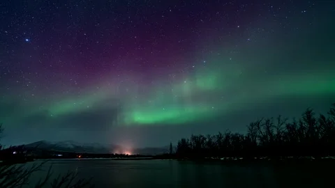 Vibrant northern lights dancing in starr... | Stock Video | Pond5