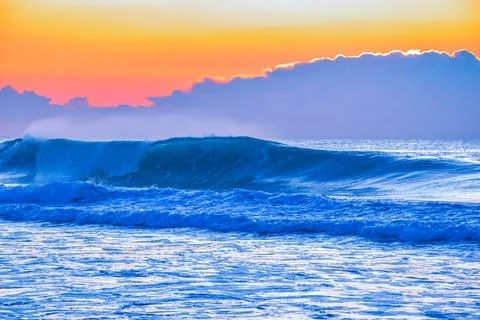 Vibrant ocean sunrise Stock Photos