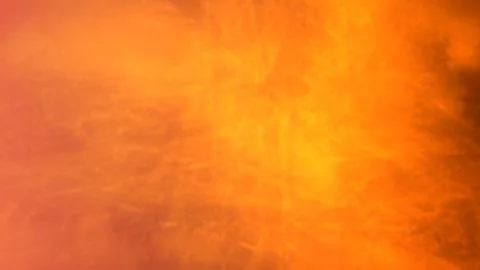 Vibrant orange and yellow cloudy sky with warm lighting Stock Illustration