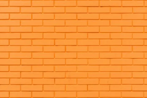 Vibrant orange brick wall pattern as graphic design element and background... Stock Photos