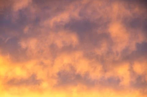 Vibrant orange cloudscape Stock Photos