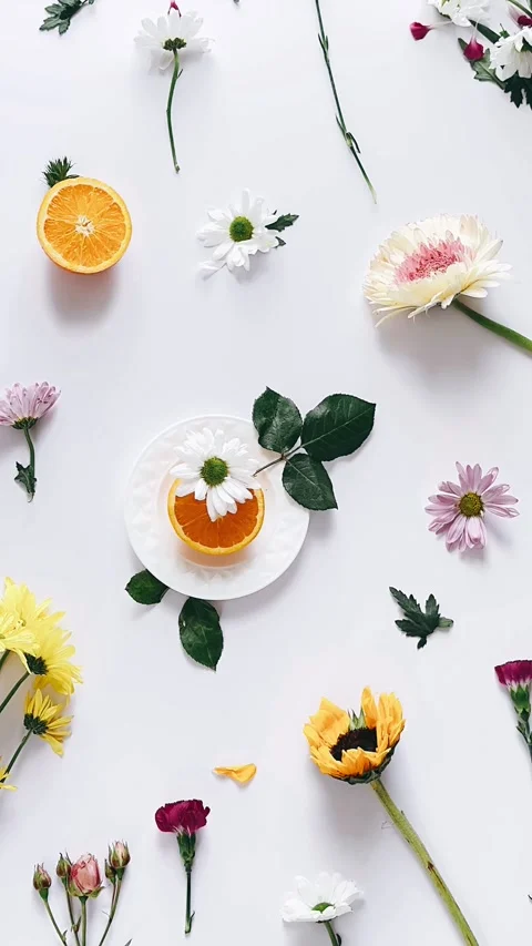 Vibrant orange display, elegant fruit and flower setup, charming floral decor Stock Footage 306799721