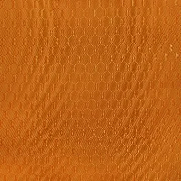 Vibrant orange fabric with hexagonal pattern Stock Photos