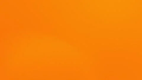 Vibrant orange gradient fills the frame with soft transitions, creating a Stock Footage 309058773