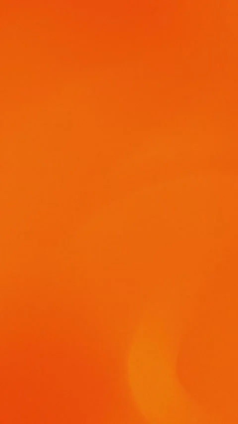 Vibrant orange gradient with soft curves. Seamless loop background in 4K. Vídeos de archivo 309856147