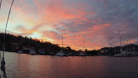 Vibrant Orange Sunset Over Caribbean Yacht Marina Stock Footage 332579344