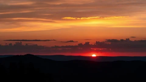 Vibrant orange sunset over mountains. Static shot time lapse Видео 280838498