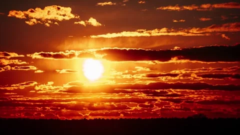 Vibrant Orange Sunset Timelapse with Dramatic Cloudscape Stock Footage 304758744
