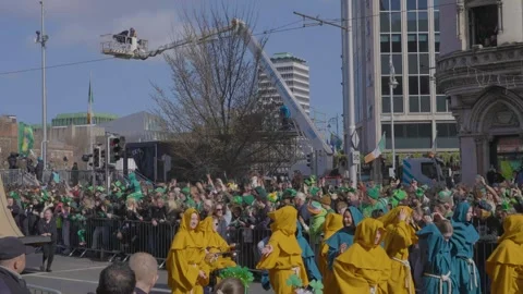 A vibrant parade float featuring a large Celtic scroll moves through Dublin Video stock 334687802