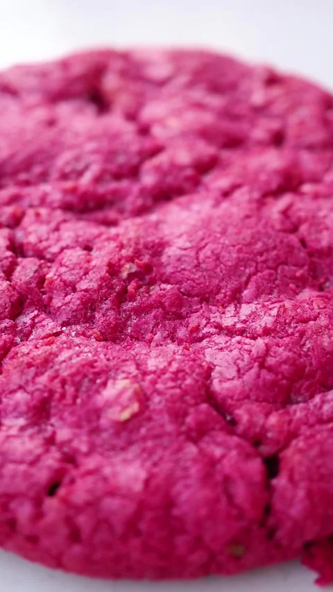 Vibrant Pink Cookie with Crinkled Texture Close-up Stock Footage 334697201