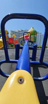 Vibrant Playground with Slide, Climbing Structure, and Carousel Stock Photos