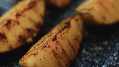 Vibrant precise culinary view: dipping a crisp wedge into herb sauce Stock Footage 342197310