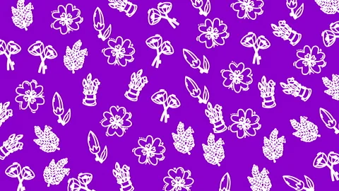 Vibrant purple backdrop features white floral patterns 库存影片 333997462