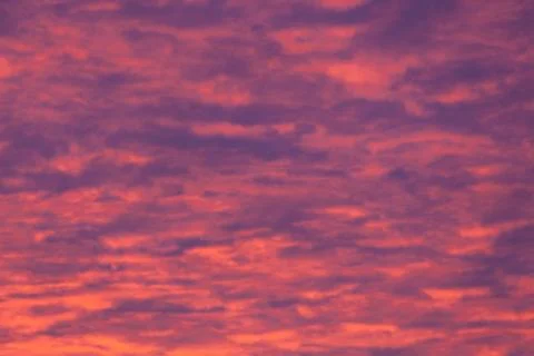 Vibrant purple clouds sunset Stock Photos