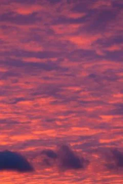 Vibrant purple clouds sunset Stock Photos