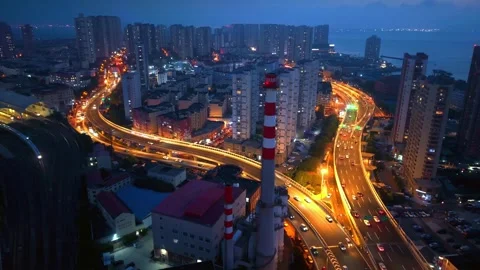 Vibrant Qingdao City Nightscape with Elevated Highway Traffic Stock Footage 330722212