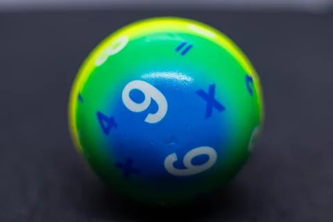 Vibrant Rainbow Learning Ball Featuring Numbers and Math Signs Stock Photos