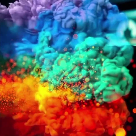 Vibrant Rainbow Smoke and Glowing Particle Burst Loop Stock Footage 336069437
