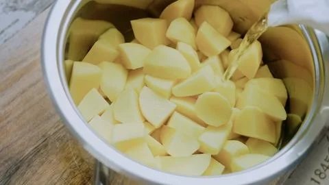 Vibrant recipe process: boiling potatoes until tender Stock Photos