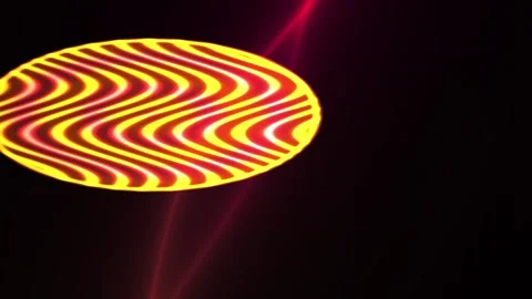 Vibrant red and yellow optical illusion disk with wavy pattern and laser beam Stock Footage 337518163