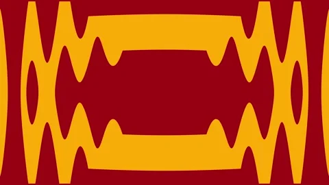 A vibrant red and yellow pattern moves outward to form an energetic portal Vídeos de archivo 332813198