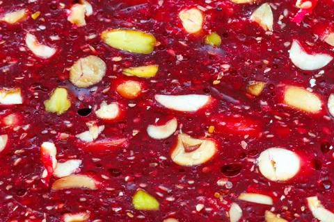 Vibrant red berry jam with mixed nuts and seeds Stock Photos