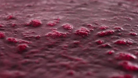Vibrant Red Berry Puree or Fruit Jam Simmering in a Pot Close Up Stock Footage 339650417