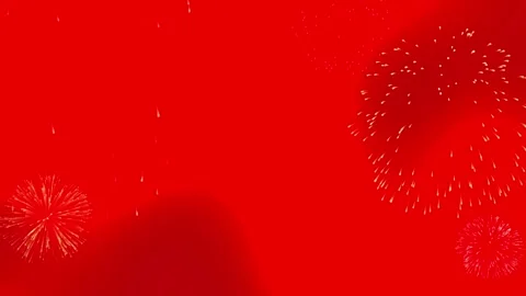 Vibrant red fireworks display exploding against glowing radiant background Stock Footage 340881371
