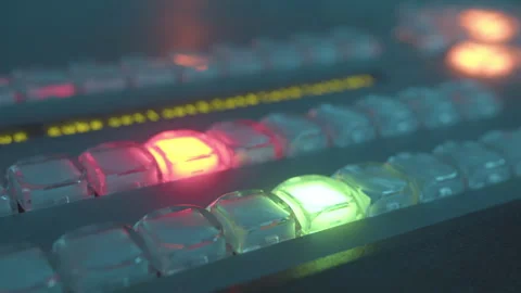 Vibrant red glow emanates from button of equalizer Stock Footage 273614607