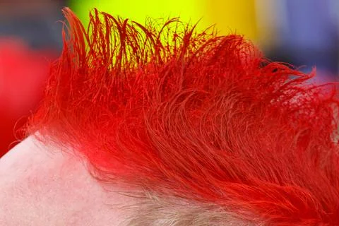 Vibrant red mohawk hair style close-up Stock Photos