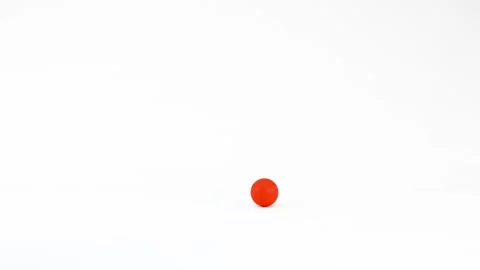 Vibrant Red Plastic Ball Rolling Across a Solid White Studio Background Stock Footage 334282315
