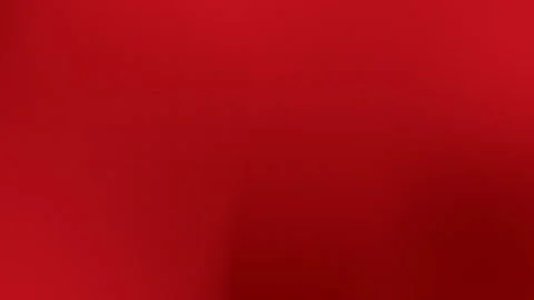 Vibrant red seamless loop background with subtle gradient and soft shadows, Stock Footage 299397120