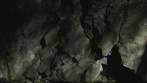 Vibrant reflection of lights and shadows on a rock at the river's edge. Video stock 267076461