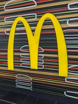 Vibrant restaurant decor featuring iconic logo in a modern eatery Stock Photos