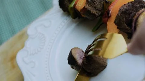 Vibrant restaurant-style serving: overhead beauty shot of grilled kebabs Stock Photos