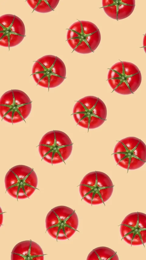 Vibrant Rotating Red Tomatoes on Beige Stock Footage 278385727