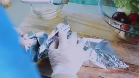 Vibrant serving moment: unwrapping beet from foil Stock Footage 342173252