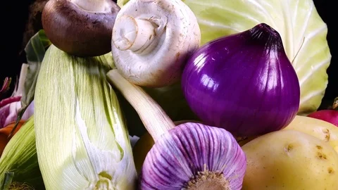 Vibrant set of vegetables close up, rotating to the right on black background Video stock 78349110