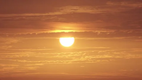 Vibrant Sky as the Sun Sets Amid Orange Clouds Video stock 311332252