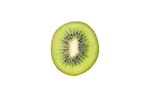 Vibrant slice of kiwi fruit showcasing its green flesh and black seeds on a.. Stock-Fotos