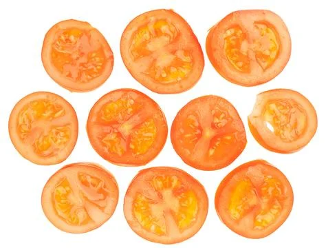 Vibrant sliced tomatoes arranged in a visually appealing grid pattern, showca Stock Photos